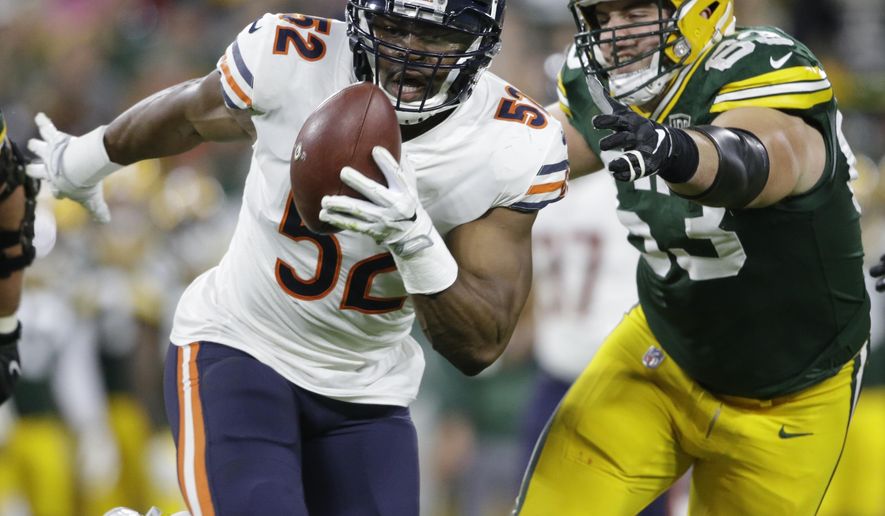 Chicago Bears&#39; Khalil Mack intercepts a pass and returns it for a touchdown during the first half of an NFL football game against the Green Bay Packers Sunday, Sept. 9, 2018, in Green Bay, Wis. (AP Photo/Jeffrey Phelps)