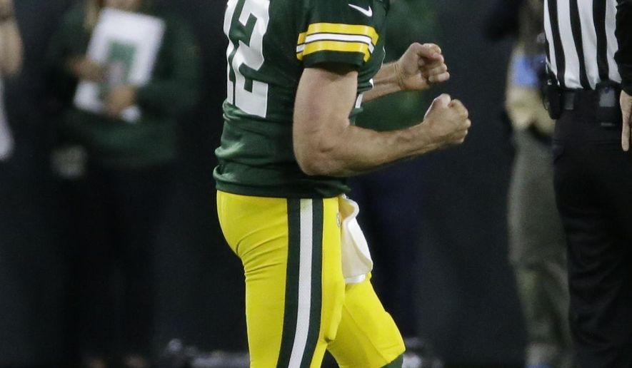 Green Bay Packers&#39; Aaron Rodgers reacts after throwing a 75-yard touchdown pass to Randall Cobb during the second half of an NFL football game against the Chicago Bears Sunday, Sept. 9, 2018, in Green Bay, Wis. (AP Photo/Mike Roemer)