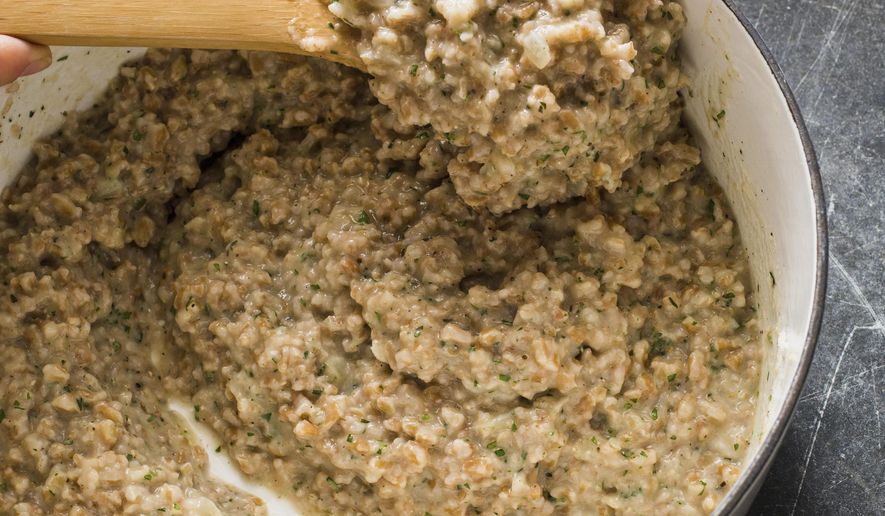 This undated photo provided by America's Test Kitchen in August 2018 shows a Parmesan farrotto in Brookline, Mass. This recipe appears in the cookbook “Complete Mediterranean.” (Carl Tremblay/America's Test Kitchen via AP)