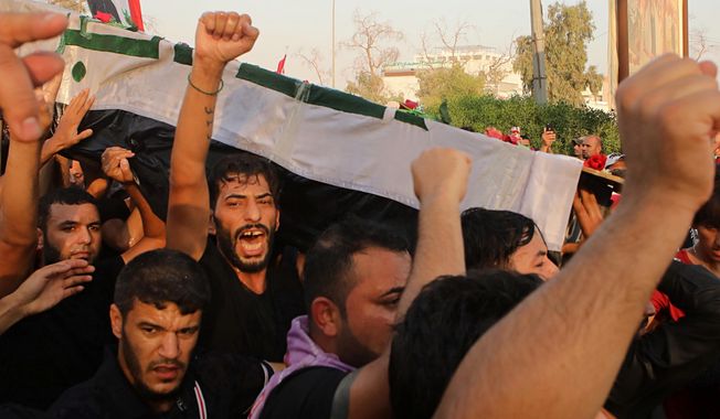 In this Friday, Sept. 7, 2018, file photo, mourners chant anti government slogans while carrying the coffin of Abdul Salam Fathi, a protester whose family said he was killed in a protest, during his funeral in Basra, Iraq. With brackish water pouring from the taps, failing city services and soaring unemployment, the southern Iraqi city of Basra has seen weeks of violent protests in the streets of the country&#x27;s oil-exporting capital. (AP Photo/Nabil al-Jurani, File)
