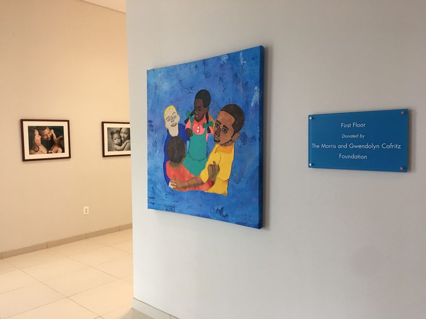 The Community of Hope Conway Health and Resource Center in southeast D.C. boasts photos and paintings by local artists reflecting the community. The health center provides pre- and post-natal care in a neighborhood with no active maternity wards. Inset: : Dr. Carla Henke is the Chief Medical Officer of Community of Hope's Conway Health and Resource Center in southeast D.C. (Courtesy Community of Hope)
(Laura Kelly) (Photographs by Laura Kelly/the Washington times)