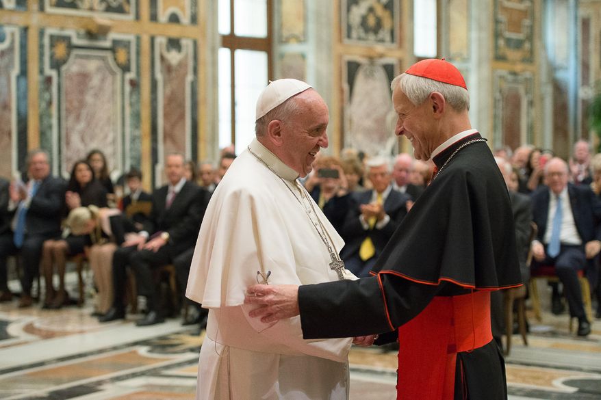 In this April 17, 2015, file photo, Pope Francis, left, talks with Papal Foundation Chairman Cardinal Donald Wuerl, Archbishop of Washington, D.C., during a meeting with members of the Papal Foundation at the Vatican. On Tuesday, Aug. 14, 2018, a Pennsylvania grand jury accused Cardinal Wuerl of helping to protect abusive priests when he was Pittsburgh's bishop. (L'Osservatore Romano/Pool Photo via AP)