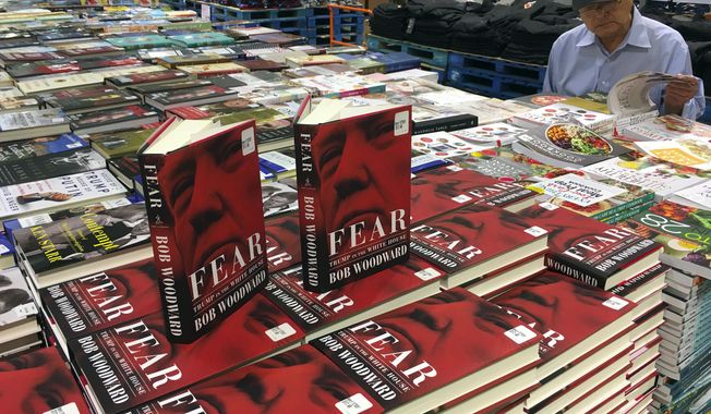 Copies of Bob Woodward&#x27;s &quot;Fear&quot; are seen for sale at Costco, Wednesday, Sept. 11, 2018 in Arlington, Va. It&#x27;s not clear whether President Donald Trump has much to fear from &quot;Fear&quot; itself. But the book of that name has set off a yes-no war between author Bob Woodward and the president, using all the assets they can muster. (AP Photo/Pablo Martinez Monsivais)