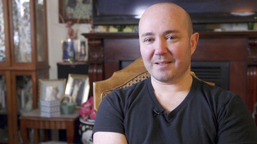 This screen grab from a video made in March 2018 and provided by the American Civil Liberties Union of Alaska shows Alex Caceda, a native of Peru. The ACLU announced Tuesday, Sept. 11, 2018, that the city of Palmer, Alaska, has agreed to settle a lawsuit brought on Caceda's behalf that alleged officers wrongfully detained him over his immigration status. (American Civil Liberties Union of Alaska via AP)