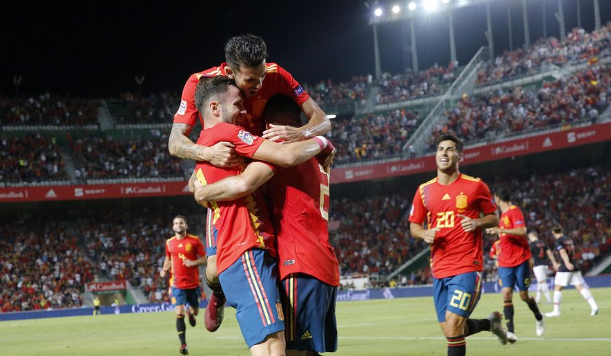Spain&#x27;s Saul Niguez, front left, celebrates with teammates after scoring his side&#x27;s opening goal during the UEFA Nations League soccer match between Spain and Croatia at the Manuel Martinez Valero stadium in Elche, Spain, Tuesday Sept. 11, 2018. (AP Photo/Alberto Saiz)