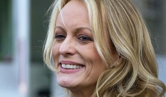 In this April 16, 2018, file photo, adult film actress Stormy Daniels speaks to members of the media after a hearing at federal court in New York. Daniels is telling her story in a new memoir titled “Full Disclosure.” The porn star who alleges an affair with President Donald Trump announced the book on ABC’s “The View” Wednesday. (AP Photo/Craig Ruttle)