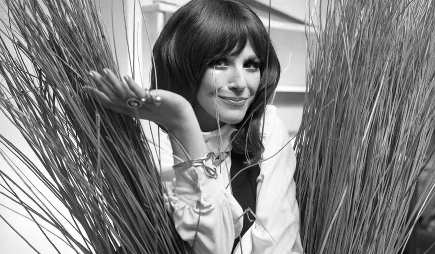 FILE - In this Sept. 16, 1971, Fenella Fielding poses ahead of a one woman entertainment piece at the Withy Arts Festival in Somerset, England. British actress Fenella Fielding, the glamorous, velvet-voiced star of "Carry On" comedies, has died at the age of 90. (PA via AP)