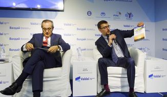 In this handout photo taken on April 19, 2016, released by Valdai Club foundation, shows Ivan Timofeev, right, and Joseph Mifsud, attend the Valdai Discussion Club Conference following the results of the closed-door Iran-Russia discussion in Moscow, Russia. No one seems to be able to find Joseph Mifsud, the Maltese academic at the center of the Russia investigation rocking Washington, but his legal woes are piling up on both sides of the Atlantic. (valdaiclub.com via AP)