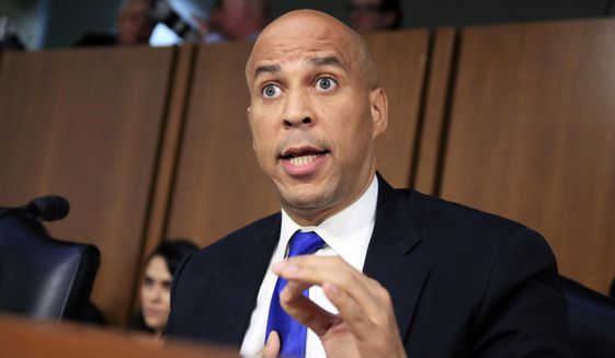 In this Sept. 4, 2018, photo, Senate Judiciary Committee member Sen. Cory Booker, D-N.J. speaks during the committee's Supreme Court nominee Brett Kavanaugh's nominations hearing on Capitol Hill in Washington. Bookerhas released a new batch of "committee confidential" documents about Kavanaugh, even after a conservative judicial group referred his earlier disclosures to the Senate Ethics Committee. The documents released Sept. 12 show Kavanaugh's involvement in President George W. Bush-era judicial nominations, including some that were controversial. Judicial Watch wants the Ethics Committee to investigate as a possible violation of Senate rules. (AP Photo/Manuel Balce Ceneta)