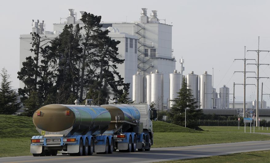 In this Sept. 12, 2018, file photo, a Fonterra milk tanker drives into the Darfield factory near Christchurch, New Zealand.  New Zealand&#39;s largest company, which sells dairy products, said Thursday, Sept. 13,  it will completely review its business investments after a disastrous financial year saw it post its first-ever loss.(AP Photo/Mark Baker)