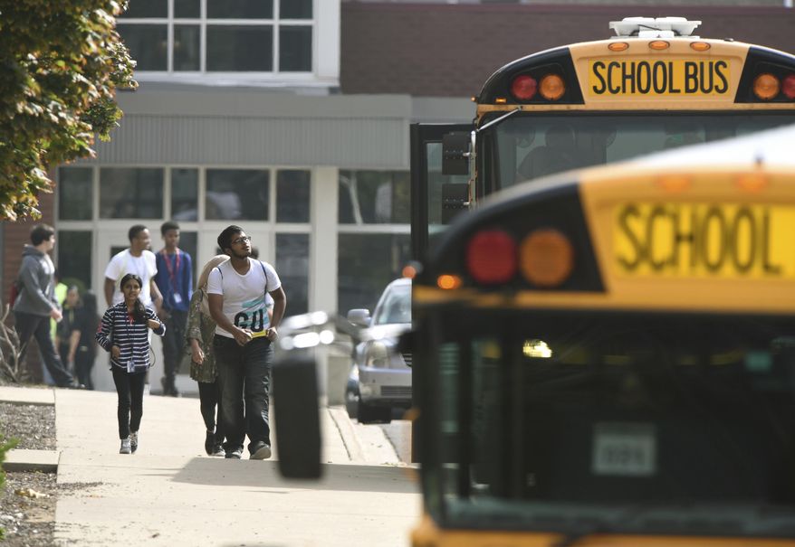 Warren Fitzgerald High School students are released from lockdown after a student was stabbed on campus Wednesday, Sept. 12, 2018, in Warren, Mich. (Max Ortiz/Detroit News via AP)