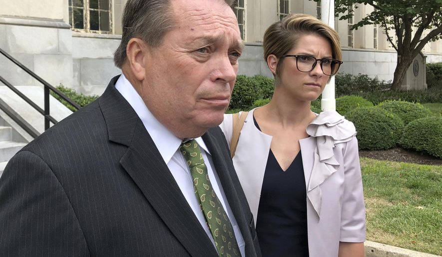 Jerry Lundergan, father of Kentucky Secretary of State Alison Lundergan Grimes, leaves the federal courthouse with his attorney Whitney True Lawson, in Lexington, Ky., on Wednesday, Sept. 12, 2018, after pleading not guilty to making illegal campaign contributions to his daughter&#39;s 2014 U.S. Senate campaign. (AP Photo/Adam Beam)