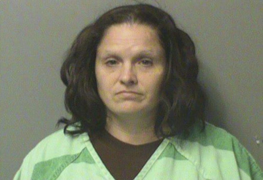 This undated photo provided by the Polk County Jail in Iowa, shows Jessica Henderson, who is accused of binding her children by the hands or feet to keep them under control. Polk County court records said Henderson is charged with child endangerment. (Polk County Jail via AP)