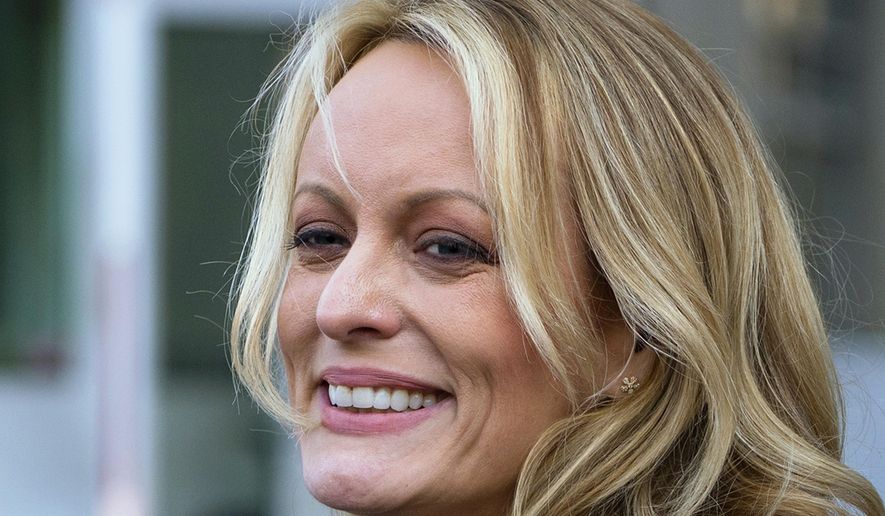FILE - In this April 16, 2018 file photo, adult film actress Stormy Daniels speaks to members of the media after a hearing at federal court in New York. Daniels is telling her story in a new memoir titled “Full Disclosure.” The porn star who alleges an affair with President Donald Trump announced the book on ABC’s “The View” Wednesday. (AP Photo/Craig Ruttle)