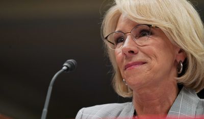 FILE - in this June 5, 2018, file photo, Education Secretary Betsy DeVos pauses as she testifies on Capitol Hill in Washington. Preliminary data obtained by The Associated Press show the Trump administration is granting only partial loan forgiveness to the vast majority of students it approves for help because of fraud by for-profit colleges. The data demonstrate the impact of DeVos new policy of tiered relief, in which students swindled by for-profit schools are compensated based on their earnings after the program. (AP Photo/Carolyn Kaster, File)