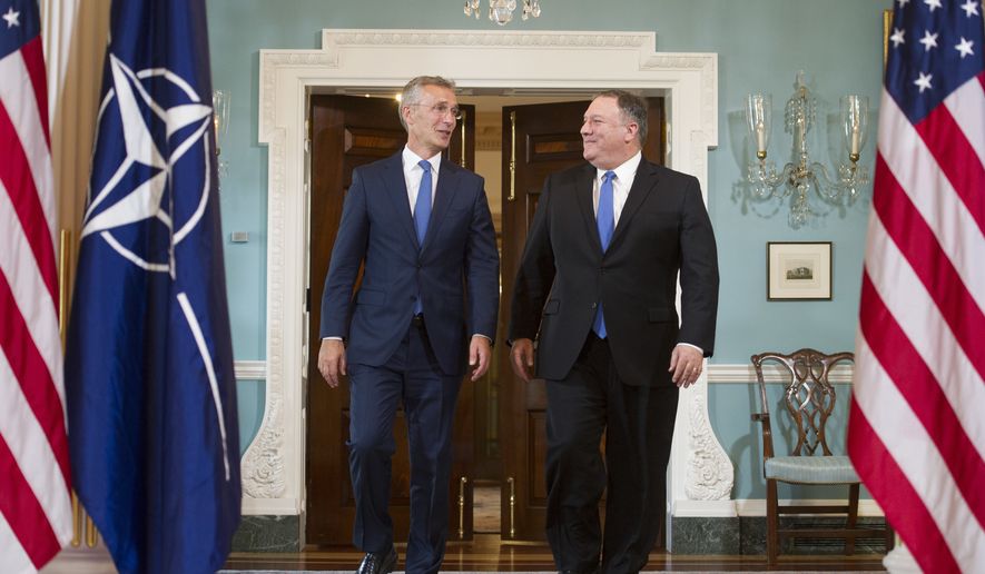 Secretary of State Mike Pompeo, right, meets with NATO Secretary General Jens Stoltenberg at the State Department in Washington, Thursday, Sept. 13, 2018. (AP Photo/Cliff Owen)