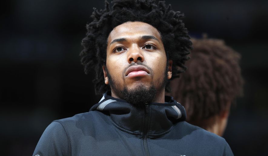FILE - In this April 1, 2018, file photo, Milwaukee Bucks guard Sterling Brown is seen during an NBA basketball game in Denver. A Milwaukee police officer involved in the stun gun arrest of Bucks&#39; player Sterling Brown has been fired because of social media posts. Police Chief Erik Morales disclosed the firing during a speech at Marquette University on Thursday, Sept. 13, 2018, but he did not name the officer. Brown sued the police department in June and accused officers of using excessive force and targeting him because he&#39;s black. (AP Photo/David Zalubowski, File)
