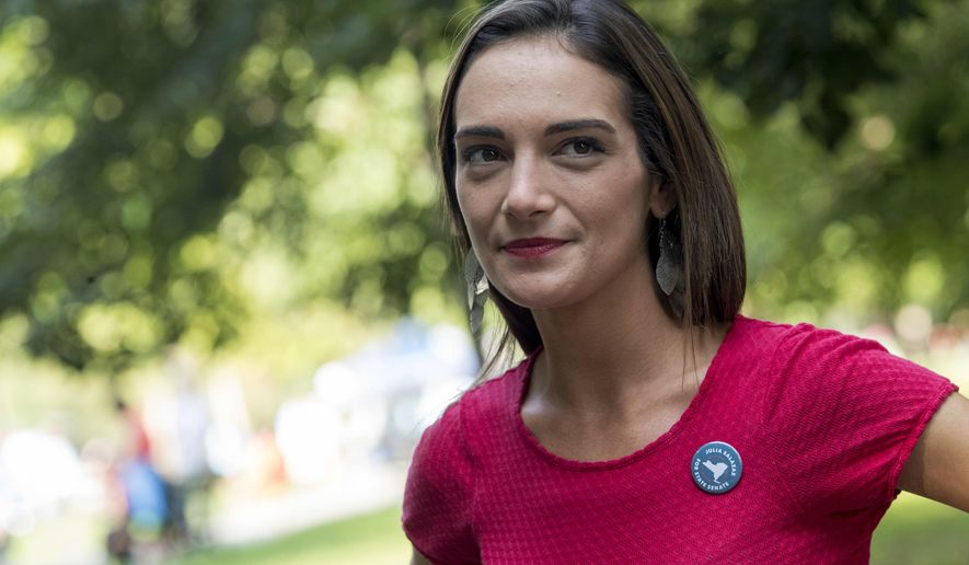 FILE - In this Aug. 15, 2018, file photo, Democratic New York state Senate candidate Julia Salazar smiles as she speaks to a supporter before a rally in McCarren Park in the Brooklyn borough of New York. Salazar is taking on 16-year-incumbent Sen. Martin Dilan in Brooklyn&#39;s 18th District. (AP Photo/Mary Altaffer, File)