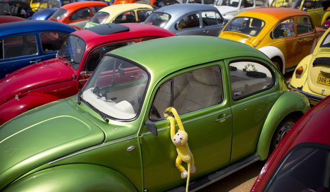 FILE- In this April 21, 2017, file photo Volkswagen Beetles displayed during the annual gathering of the &amp;quot;Beetle club&amp;quot; in Yakum, central Israel. Volkswagen says it will stop making its iconic Beetle in July of next year. Volkswagen of America on Thursday, Sept. 13, 2018, announced the end of production of the third-generation Beetle by introducing two final special editions. (AP Photo/Oded Balilty, File)