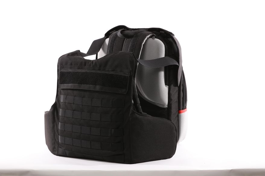 This undated photo provided by the Msada-Armour company, shows a bulletproof backpack. Masada-Armour, an Israeli company, says it has come up with a first-of-its-kind protection gear against the threat of school shootings -- a bulletproof backpack that can transform into a bulletproof vest in less than two seconds by flipping out an armored plate from a concealed compartment. (Masada-Armour via AP)
