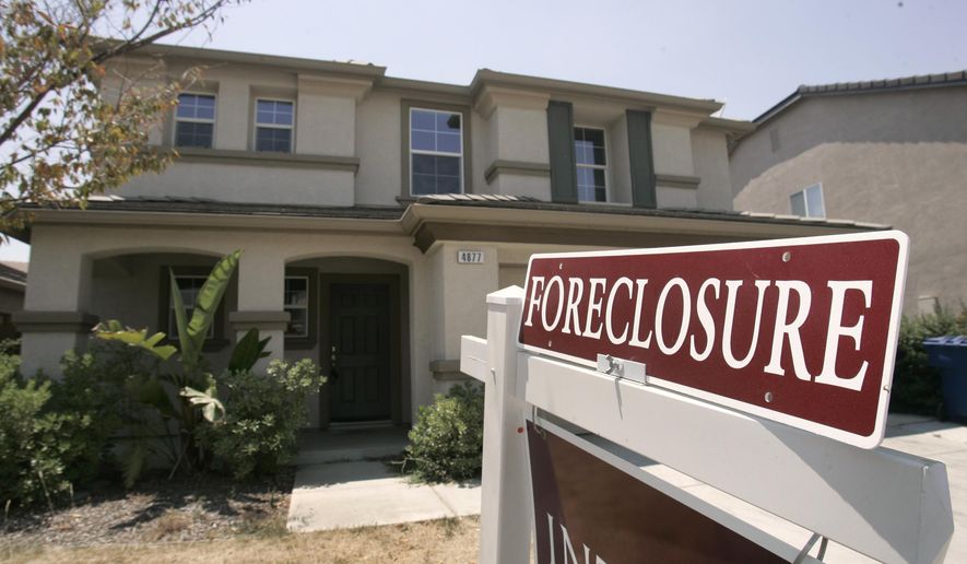 FILE- This July 2, 2008, file photo shows a foreclosed home in Sacramento, Calif. As home values plummeted after the housing bubble burst in 2007, many borrowers with exotic types of loans were stuck, unable to refinance as lenders began to tighten their lending criteria. That set the stage for cascading mortgage defaults. (AP Photo/Rich Pedroncelli, File)