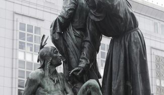 FILE - This Friday, March 2, 2018 file photo shows a statue that depicts a Native American at the feet of a Spanish cowboy and Catholic missionary in San Francisco. A San Francisco board has decided to remove the 19th-century statue that activists say is racist and demeaning to indigenous people. The San Francisco Board of Appeals voted Wednesday, Sept. 12, 2018, on the “Early Days” statue. (AP Photo/Jeff Chiu, File)