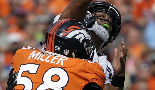 FILE - In this Sept. 9, 2018, file photo, Seattle Seahawks quarterback Russell Wilson, top, loses the ball as he is hit by Denver Broncos linebacker Von Miller (58) during the first half of an NFL football game, in Denver. Von Miller might be the only one at Broncos headquarters lamenting Khalil Mack&#x27;s startling trade from the Oakland Raiders to the Chicago Bears.  (AP Photo/Jack Dempsey, File)