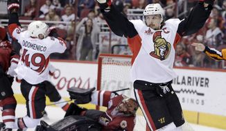FILE - In this March 9, 2017, file photo, Ottawa Senators defenseman Erik Karlsson (65) celebrates after scoring a goal against the Arizona Coyotes during the third period during an NHL hockey game in Glendale, Ariz. The San Jose Sharks have acquired two-time Norris Trophy-winning defenseman Erik Karlsson from the Senators, the teams announced Thursday, Sept. 13, 2018. ( AP Photo/Rick Scuteri)