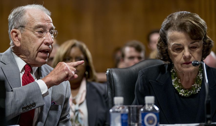 Senate Judiciary Committee Chairman Chuck Grassley, R-Iowa, left, accompanied by Sen. Dianne Feinstein, D-Calif., the ranking member, right, speaks during a Senate Judiciary Committee markup meeting on Capitol Hill, Thursday, Sept. 13, 2018, in Washington. The committee will vote next week on whether to recommend President Donald Trump&#39;s Supreme Court nominee, Brett Kavanaugh for confirmation. Republicans hope to confirm him to the court by Oct. 1.(AP Photo/Andrew Harnik)