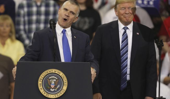 Republican Senate candidate Matt Rosendale, left, and President Donald Trump speak at a rally at the Rimrock Auto Arena in Billings, Mont., Thursday, Sept. 6, 2018. President Trump used the stop to show support for Rosendale. (AP Photo/Jim Urquhart)