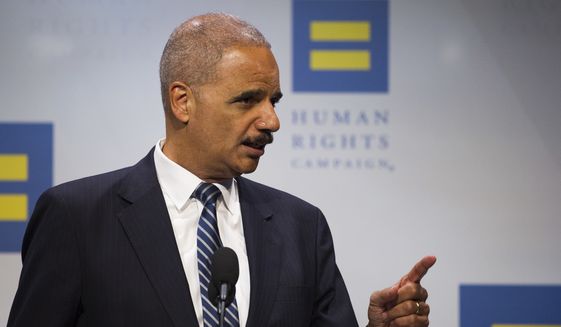 Former Attorney General Eric Holder addresses the Human Rights Campaign National Dinner in Washington, D.C., Saturday, Sept. 15, 2018. (AP Photo/Cliff Owen)