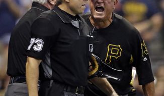Pittsburg Pirates manager Clint Hurdle, right, argues with home plate umpire Tripp Gibson (73) after getting thrown out of the game against the Milwaukee Brewers during the sixth inning of a baseball game, Saturday, Sept. 15, 2018, in Milwaukee. (AP Photo/Jeffrey Phelps)