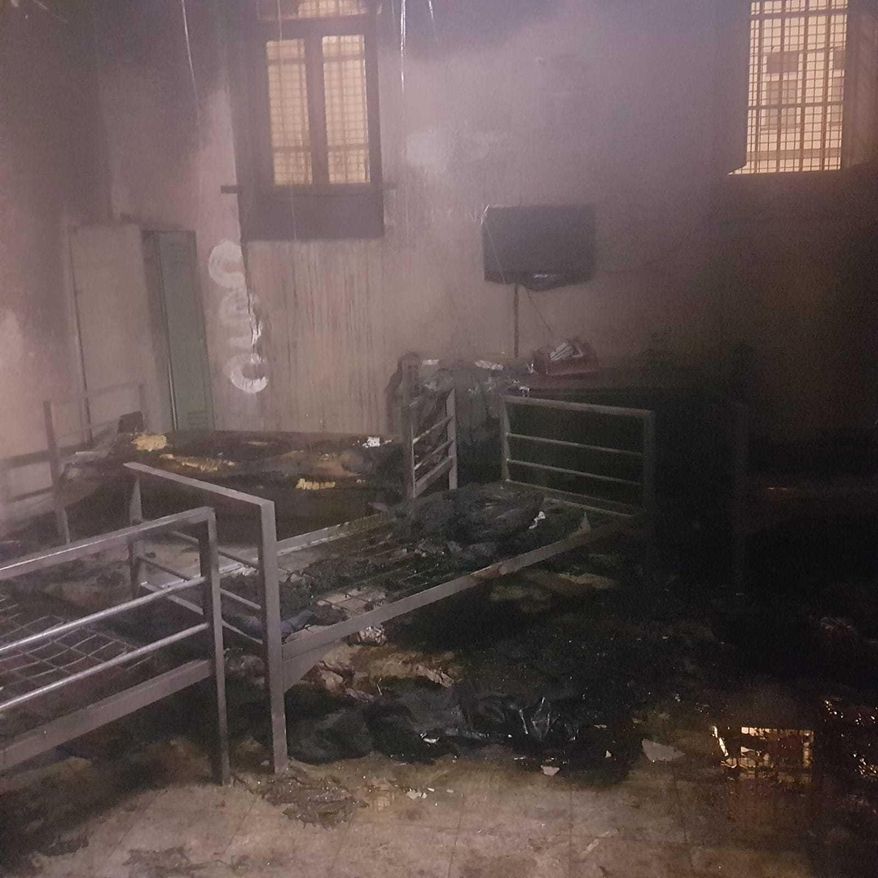 This picture provided by the Police in Vienna, Austria, Saturday, Sept. 15, 2018 shows a burned-out deportation cell. Austrian police say six men have been hospitalized with serious injuries after setting alight the mattresses and bedding of the deportation cell in which they were being held. (Police Vienna via AP)