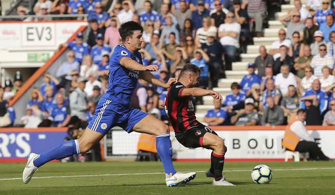Bournemouth&#x27;s Ryan Fraser, right, scores his side&#x27;s second goal of the game during the English Premier League soccer match between Bournemouth and Leicester City at the Vitality Stadium, in Bournemouth, England, Saturday, Sept.  15, 2018. (Mark Kerton/PA via AP)