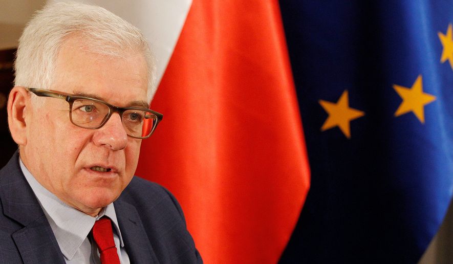 Poland&#x27;s Foreign Minister Jacek Czaputowicz says that President Andrzej Duda will discuss boosting the U.S. military presence in Poland and greater U.S. economic involvement when he is hosted by President Donald Trump at the White House next week, during an interview for The Associated Press in Warsaw, Poland, Friday, Sept. 14, 2018. (AP Photo/Czarek Sokolowski)