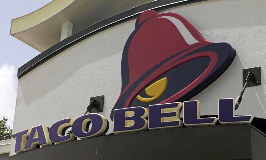 This Thursday, Aug. 3, 2017, photo shows a Taco Bell sign at a restaurant in Hialeah, Fla. Yum Brands, Inc., which operates Taco Bell, KFC and Pizza Hut, reports earnings, Thursday, Nov. 2, 2017. (AP Photo/Alan Diaz)