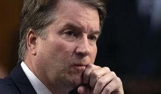 Brett M. Kavanaugh, Supreme Court nominee, and a fellow Georgetown Preparatory School student, &quot;corralled&quot; Christine Blasey Ford in a bedroom at a party in the early 1980s and tried to sexually assault her, she told The Washington Post. (Associated Press/File)