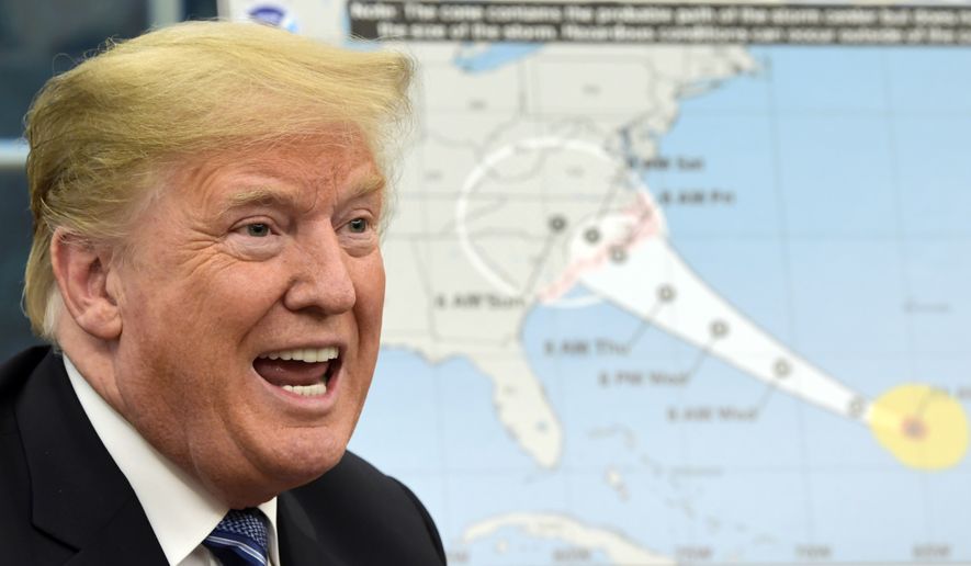 President Donald Trump talks about Hurricane Florence following a briefing in the Oval Office of the White House in Washington, Tuesday, Sept. 11, 2018. (AP Photo/Susan Walsh)
