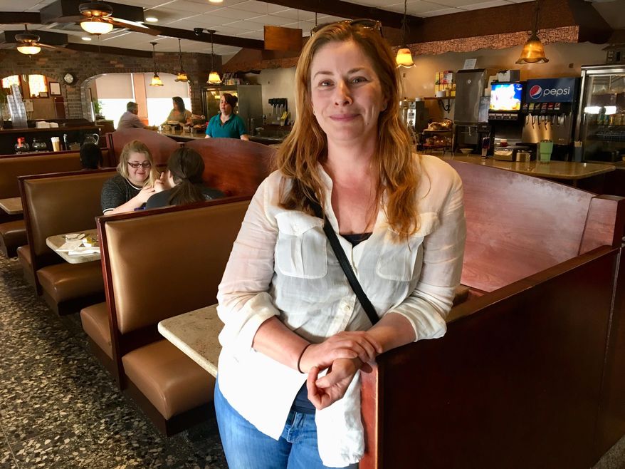 File-This May 2, 2018, file photo shows actress Diane Neal posing at a diner, during an interview in Kingston, N.Y. Neal will be on the November ballot as an independent congressional candidate in a sprawling upstate New York district after winning a court case over her petition signatures. The state Board of Elections last month rejected over 1,800 of the more than 4,100 signatures on Neal's petition to get on the ballot in the 19th Congressional District. On Monday, Sept. 17, 2018, the state Supreme Court Appellate Division ruled in Neal's favor in her challenge of the decision. Democrat Antonio Delgado is challenging Republican Rep. John Faso to represent the district north of the New York City metro area. Neal portrayed Assistant District Attorney Casey Novak on "Law and Order: SVU." She hasn't held political office and lives in the Ulster County village of Hurley. (AP Photo/Mary Esch, File)