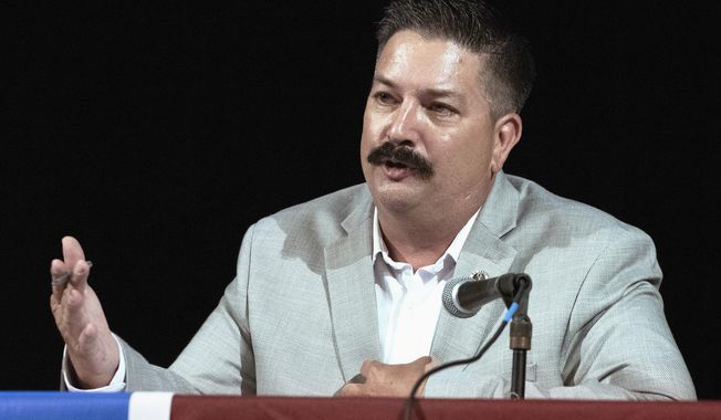 FILE - In this July 8, 2018, file photo, Randy Bryce, a Wisconsin Democratic candidate for the U.S. House, answers a question during a debate in Lake Geneva, Wis. Bryce is running against Republican Bryan Steil to replace House Speaker Paul Ryan. A Republican super PAC aligned with Ryan is launching an attack ad Monday, Sept. 17, 2018, against Bryce over his arrest record. (Angela Major/The Janesville Gazette via AP, File)