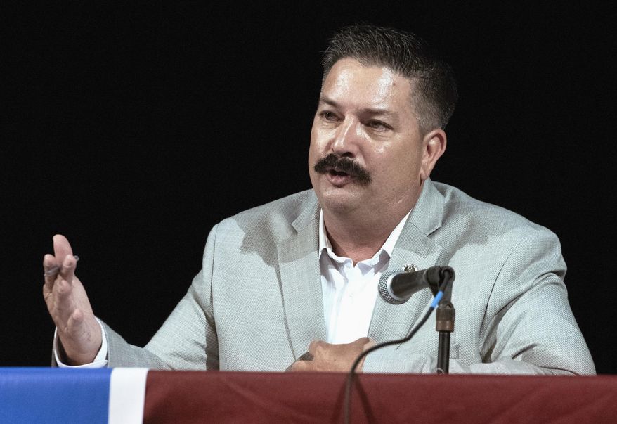 FILE - In this July 8, 2018, file photo, Randy Bryce, a Wisconsin Democratic candidate for the U.S. House, answers a question during a debate in Lake Geneva, Wis. Bryce is running against Republican Bryan Steil to replace House Speaker Paul Ryan. A Republican super PAC aligned with Ryan is launching an attack ad Monday, Sept. 17, 2018, against Bryce over his arrest record. (Angela Major/The Janesville Gazette via AP, File)