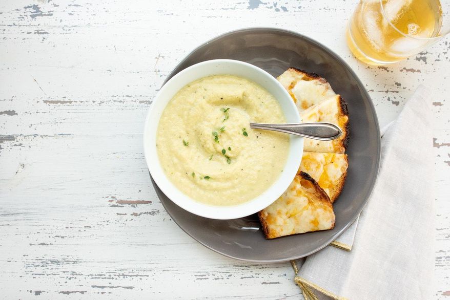 This May 2018 photo shows a parsnip and golden beet soup in New York. This dish is from a recipe by Katie Workman. (Cheyenne Cohen via AP)