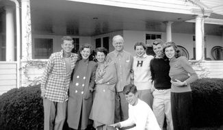 In this circa 1948 photo provided by the Kennedy Family Collection, courtesy of the John F. Kennedy Library Foundation, members of the Kennedy family pose for a photo in Hyannis Port, Mass. They are from left, John F. Kennedy, Jean Kennedy, Rose Kennedy, Joseph P. Kennedy Sr., Patricia Kennedy, Robert F. Kennedy, Eunice Kennedy, and in foreground, Edward M. Kennedy. The Boston-based museum completed an 18-month project in 2018 to catalog and digitize more than 1,700 black-and-white Kennedy family snapshots that are viewable online, giving a nation still obsessed with &amp;quot;Camelot&amp;quot; a candid new glimpse into their everyday lives. (Kennedy Family Collection/John F. Kennedy Library Foundation via AP)