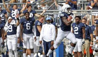 Penn State&#39;s Daniel George (86) catches a pass and takes it 95 yards for a touchdown against Kent State during the second half of an NCAA college football game in State College, Pa., Saturday, Sept. 15, 2018. Penn State won 63-10. (AP Photo/Chris Knight)