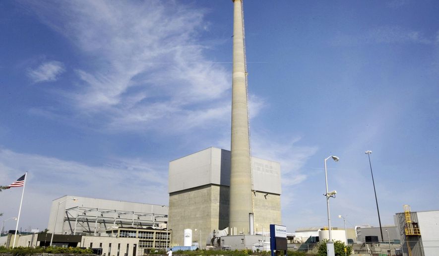 FILE - This 2010 file photo shows Exelon Corp.'s Oyster Creek Generating Station, a nuclear power plant in Lacey Township, N.J. America’s oldest nuclear power plant is shutting down Monday, Sept. 17, 2018. (Peter Ackerman/The Asbury Park Press via AP, File)