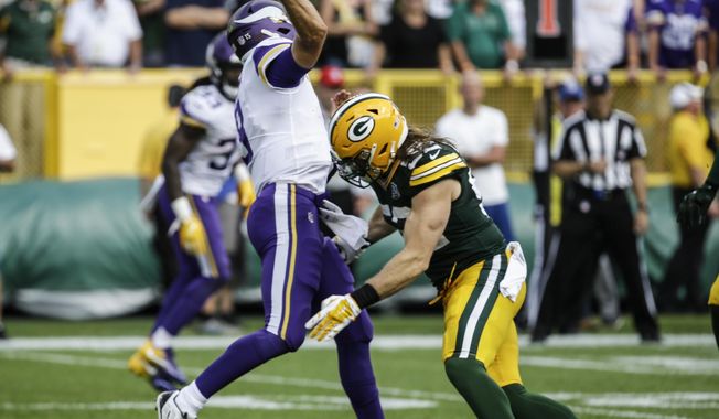 Green Bay Packers&#x27; Clay Matthews is called for a roughing the passer penalty during the second half of an NFL football game against the Minnesota Vikings Sunday, Sept. 16, 2018, in Green Bay, Wis. The game ended in a 29-29 tie. (AP Photo/Mike Roemer)