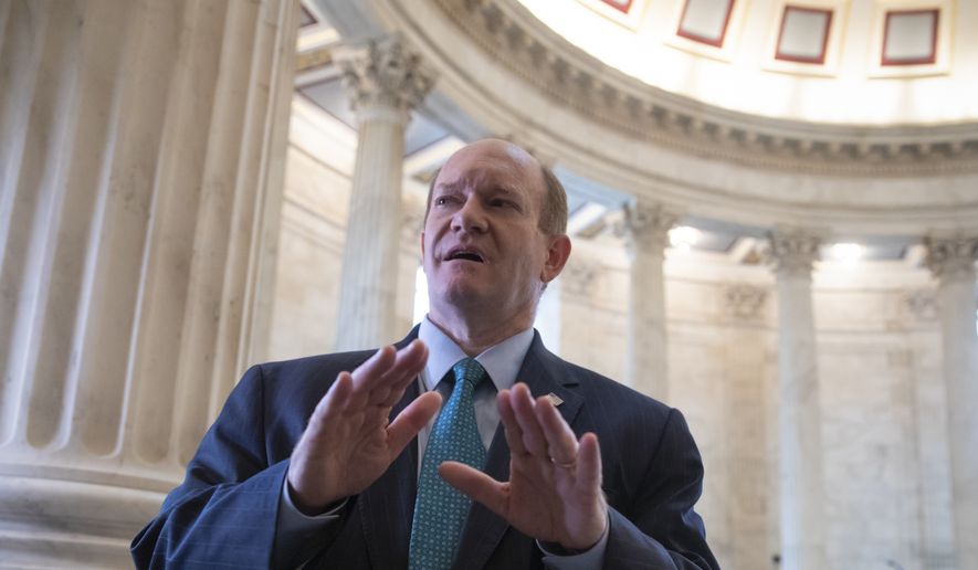 Sen. Chris Coons, D-Del., a member of the Senate Judiciary Committee, speaks to reporters on Capitol Hill in Washington, Tuesday, Sept. 18, 2018. (AP Photo/J. Scott Applewhite) ** FILE **