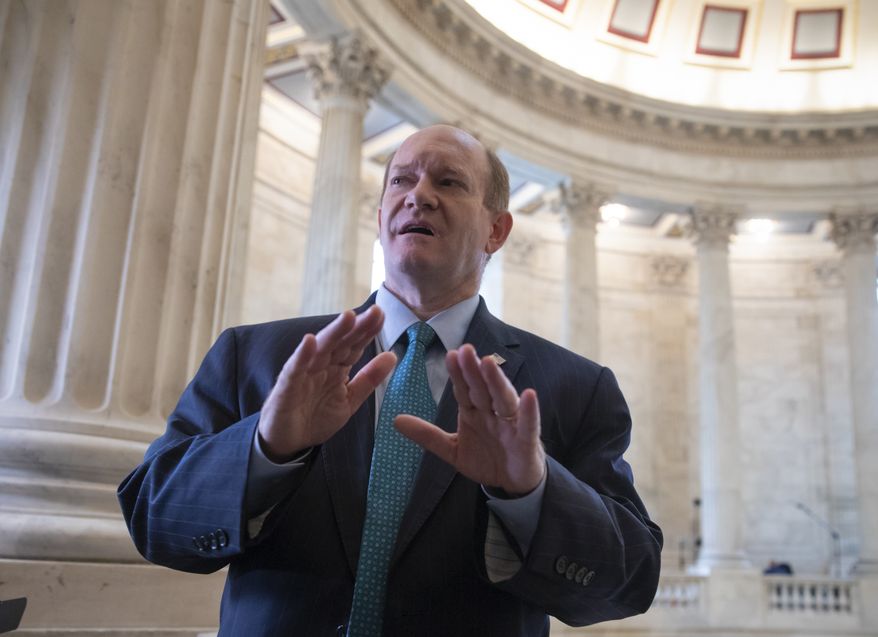 Sen. Chris Coons, D-Del., a member of the Senate Judiciary Committee, speaks to reporters on Capitol Hill in Washington, Tuesday, Sept. 18, 2018. (AP Photo/J. Scott Applewhite) ** FILE **