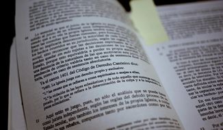 This Sept. 10, 2018 photo shows a page in one of four books written by Argentine criminal defense attorney Marcelo Sancinetti, with a sentence that reads in Spanish: “The church judges with its own exclusive right,&amp;quot; in Buenos Aires, Argentina. In 2010 Pope Francis commissioned the four volume, 2,000-plus page forensic study of a legal case against a convicted priest that concluded he was innocent, that his victims were lying and that the case never should have gone to trial. (AP Photo/Natacha Pisarenko)