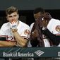 Baltimore Orioles&#39; John Andreoli, left, and Adam Jones stand in the dugout in the ninth inning of a baseball game against the Toronto Blue Jays, Tuesday, Sept. 18, 2018, in Baltimore. Toronto won 6-4. (AP Photo/Patrick Semansky)